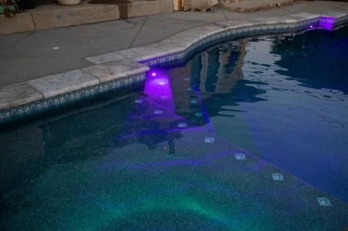 Orange County pool built by Pool Icons with underwater purple lights