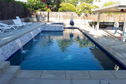 Inland Empire custom pool design with bright blue tiling