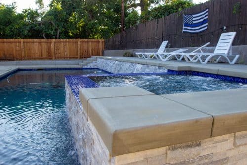 custom backyard pool design with built-in spa