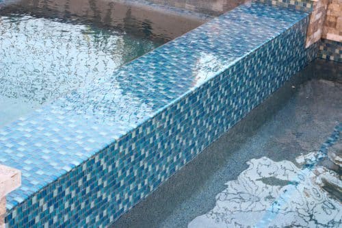 blue-tiled luxury swimming pool design