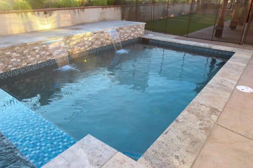 custom backyard pool construction with waterfall features Inland Empire