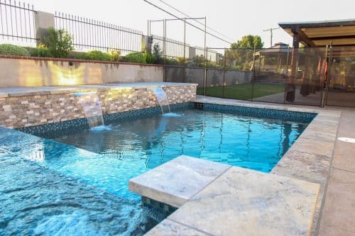 custom backyard pool construction with waterfall features Temecula