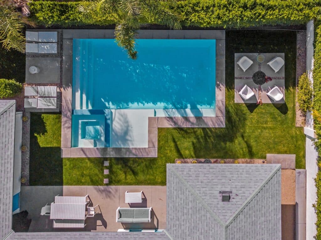 bird's eye view of backyard with a recent pool remodeling