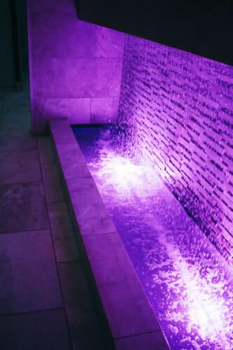 Water fountain waterfall lit purple