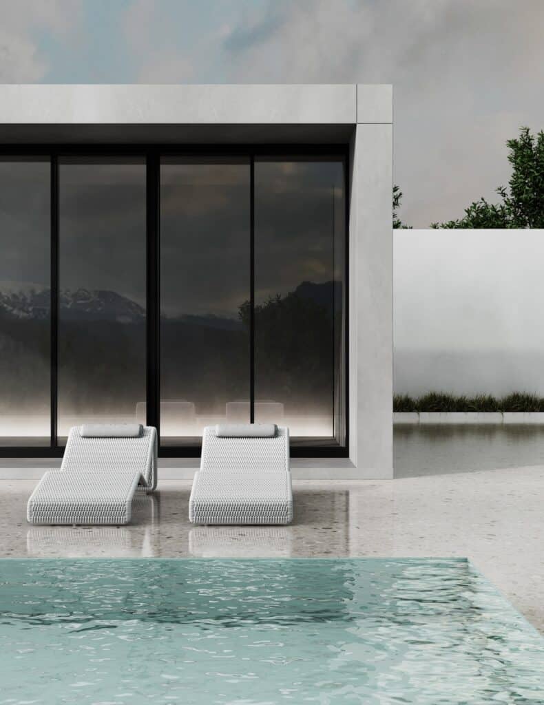 backyard luxury swimming pool with chairs and sleek patio