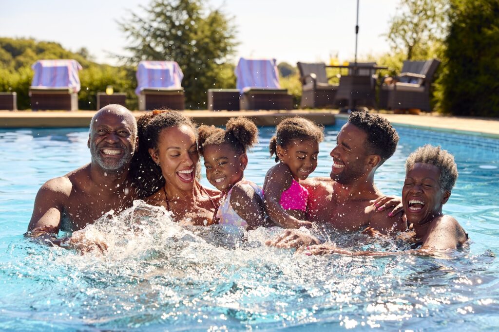 backyard pool for kids and family members having fun swimming together