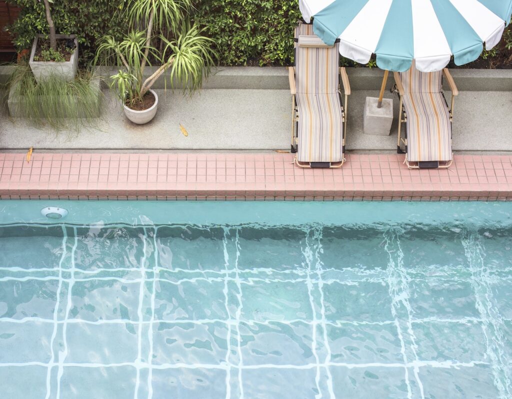 backyard swimming pool in the summer